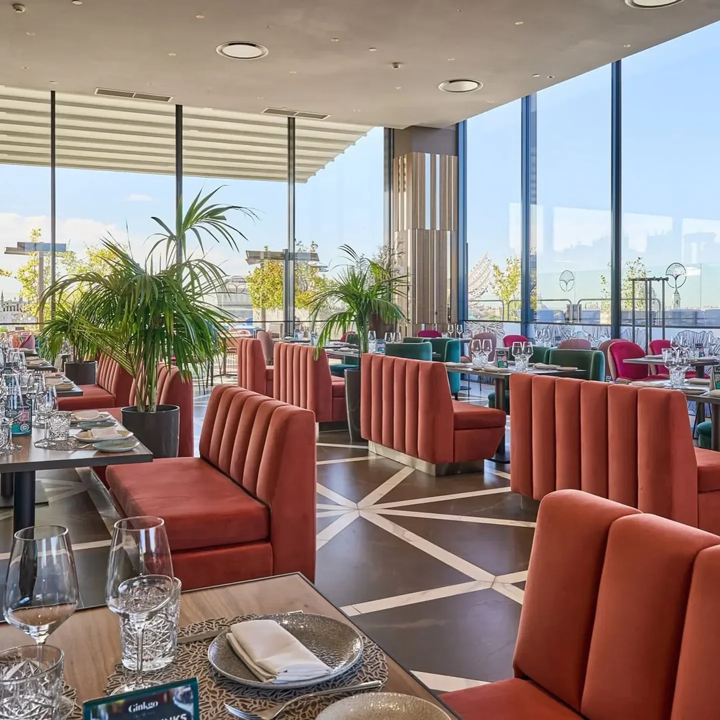 Interior of Ginkgo Sky Bar in Madrid with elegant seating and city views.