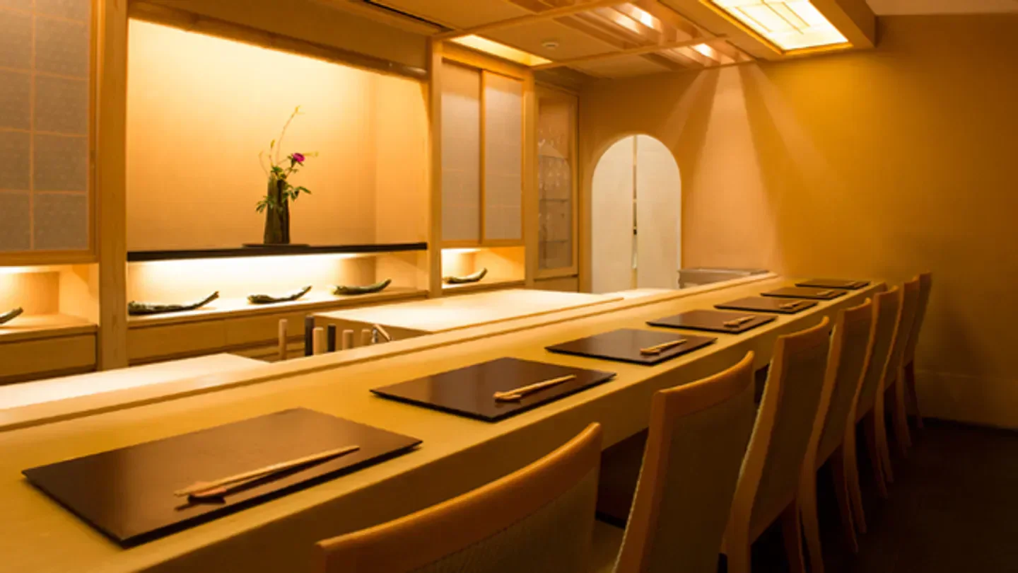 Elegant dining area at Ginza Okuda, a restaurant in Tokyo, showcasing Japanese minimalism.