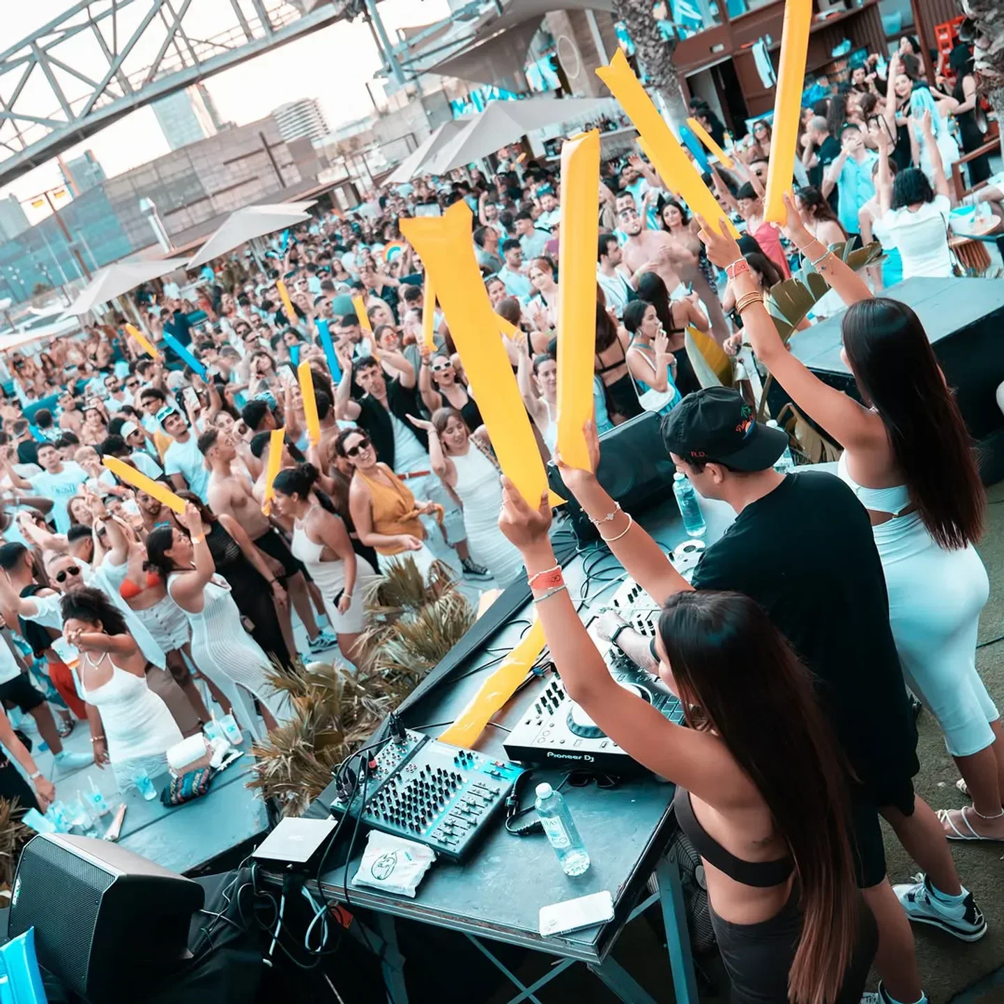 Party at Go Beach Club in Barcelona with DJ and crowd celebrating.