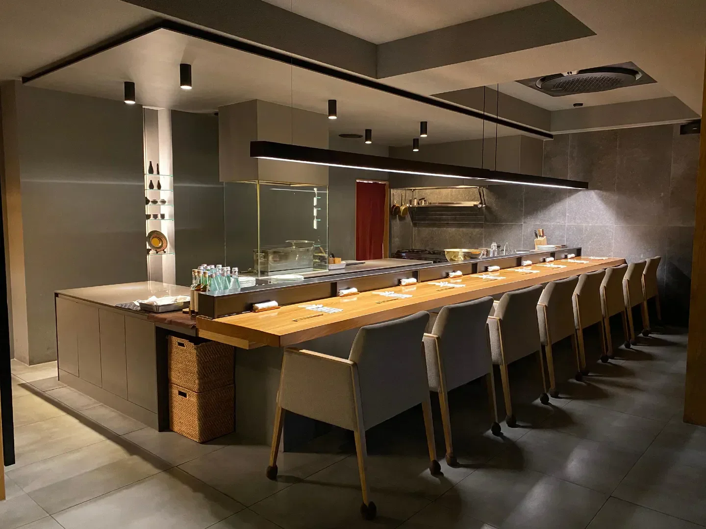Interior of Goryori Ken restaurant in Seoul, featuring counter seating and modern design.