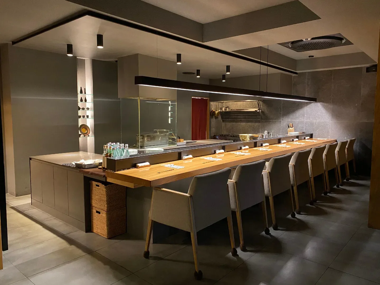 Interior of Goryori Ken restaurant in Seoul, featuring counter seating and modern design.