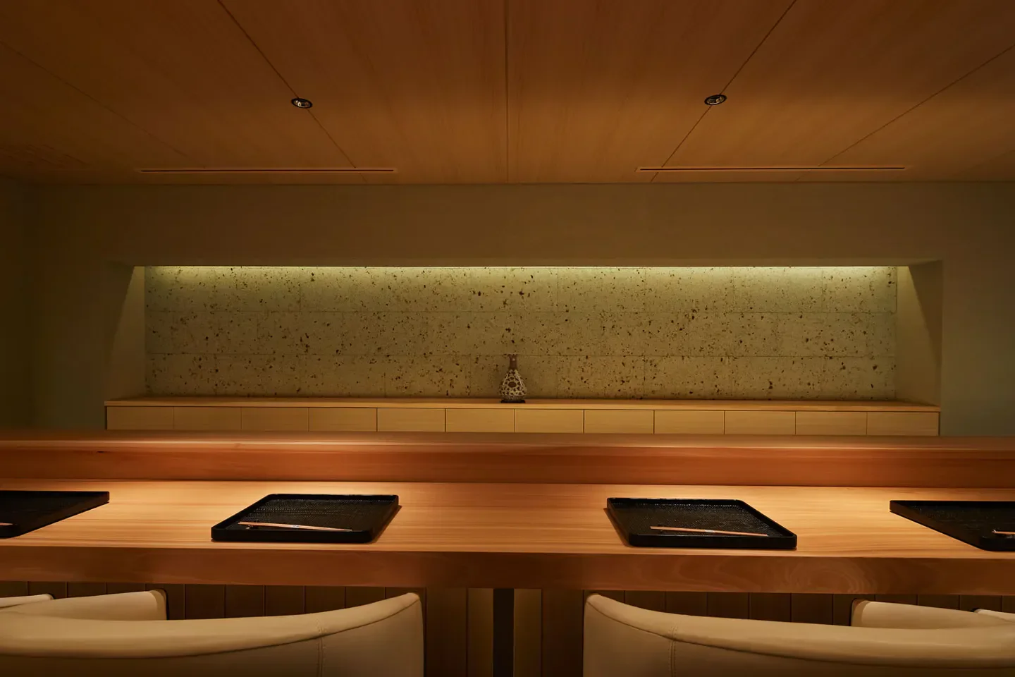 Goryukubo restaurant in Tokyo: minimalist interior with wooden counter and neutral tones.