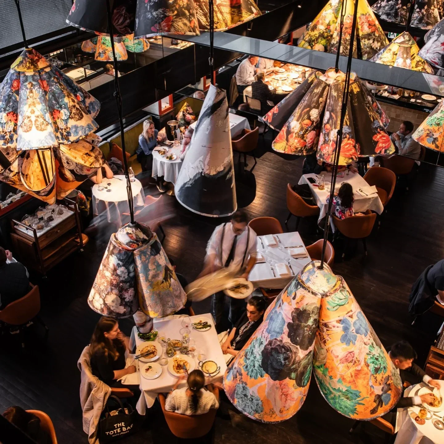 Dining room at Gowings Bar & Grill in Sydney, featuring unique floral lamps.
