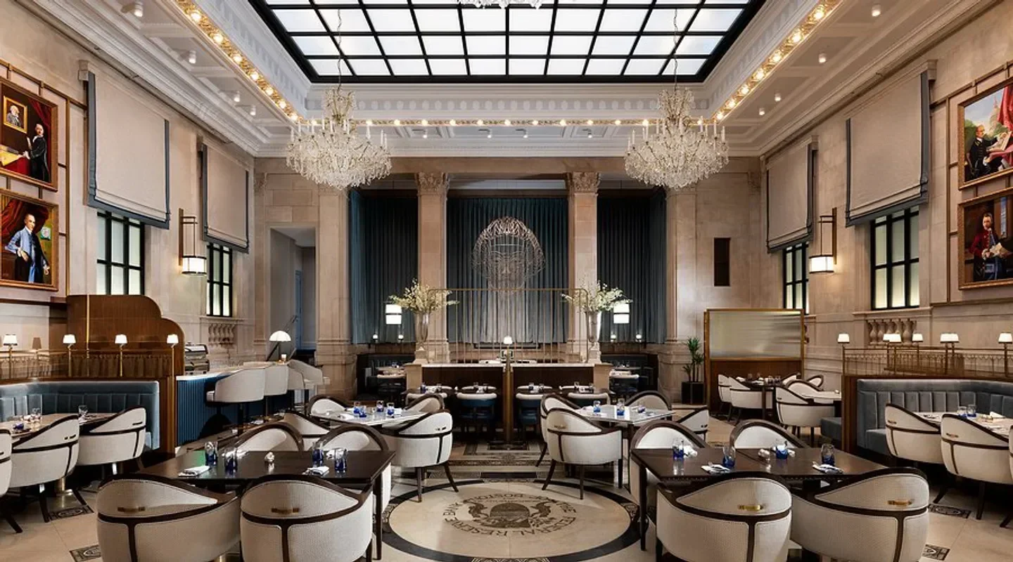 Elegant interior dining room at Grana restaurant in Boston, featuring chandeliers and tables