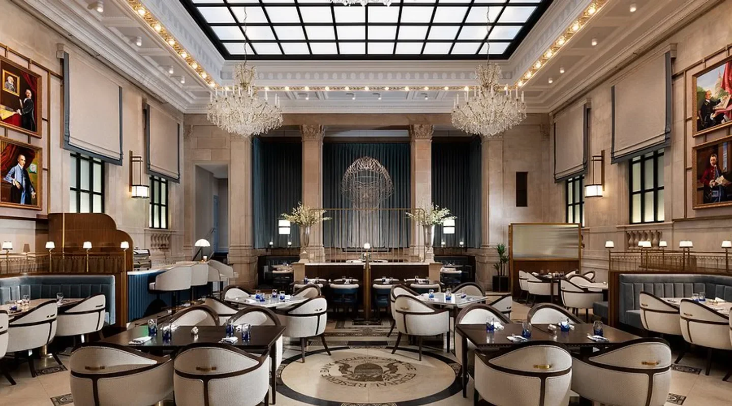 Elegant interior dining room at Grana restaurant in Boston, featuring chandeliers and tables