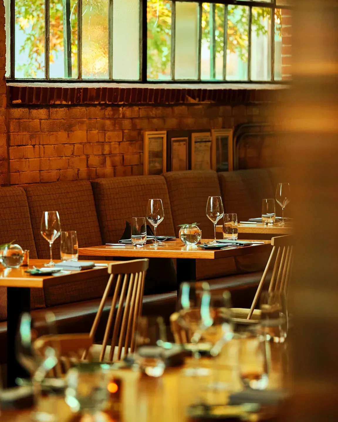Cozy dining area at Gravitas in Washington, with elegant table settings ready.