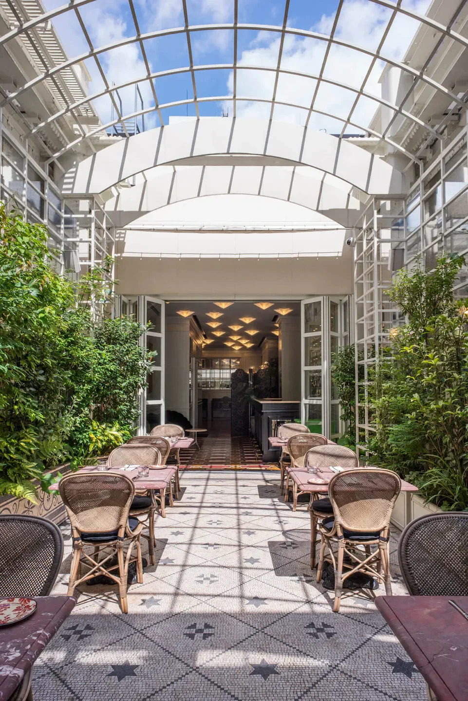 Outdoor seating at Gucci Osteria da Massimo Bottura - Tokyo, offering a chic dining experience in Tokyo.