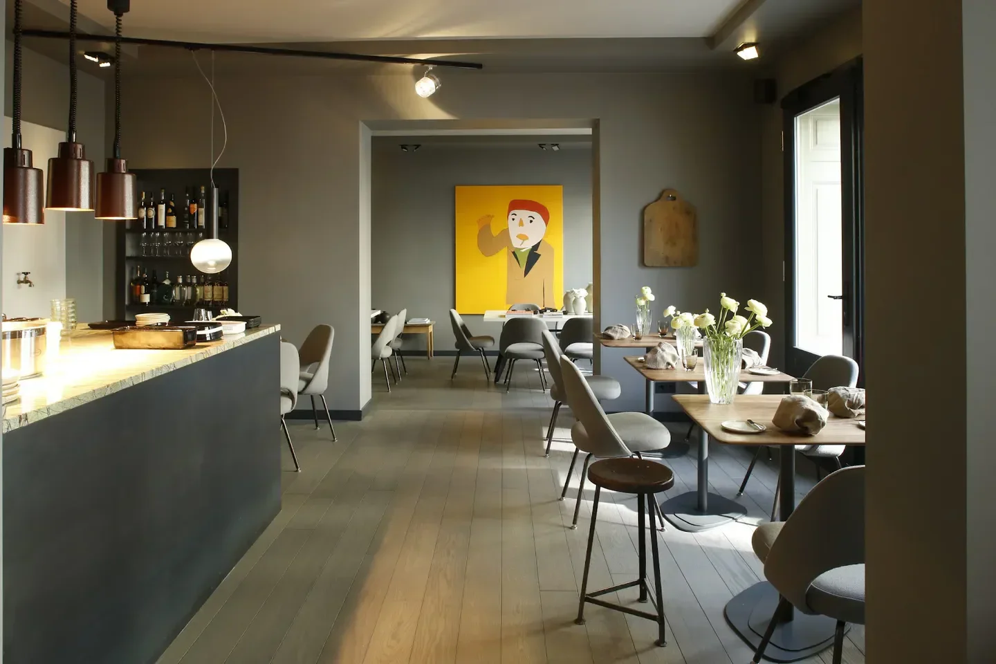Interior of Gustav restaurant in Frankfurt, featuring stylish decor and a unique art piece.
