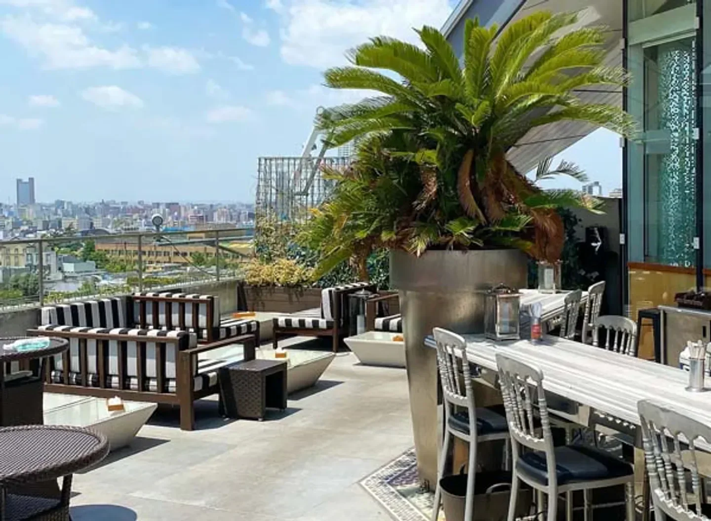 Rooftop terrace at Hacienda Del Cielo in Tokyo with city views and stylish decor