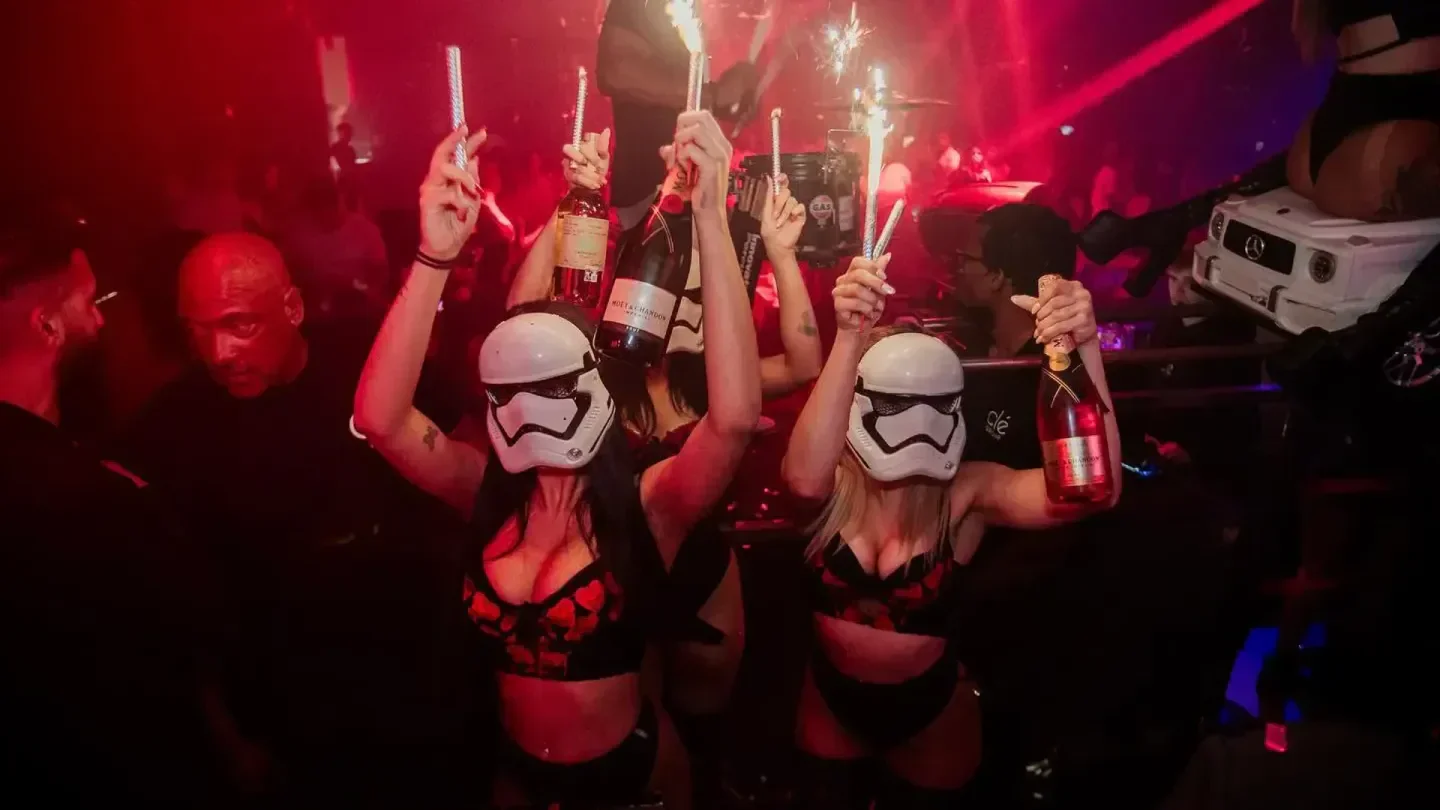 Party at Heart nightclub in Houston with champagne and stormtrooper masks.