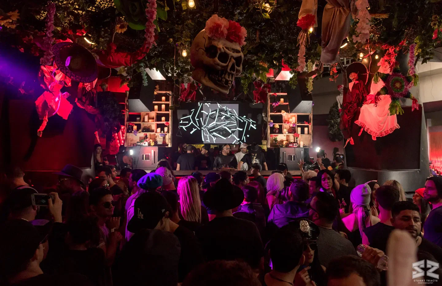Decorated interior of Heart Nightclub in Miami with a crowd of people partying.