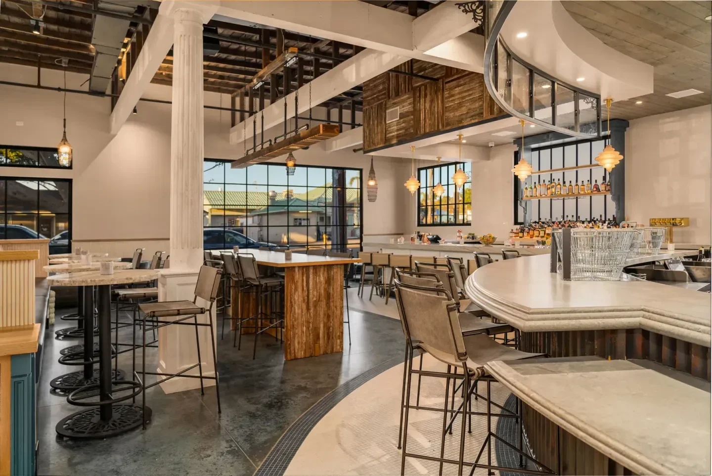 Interior of Herb & Sea restaurant in San Diego, featuring a stylish bar and seating.