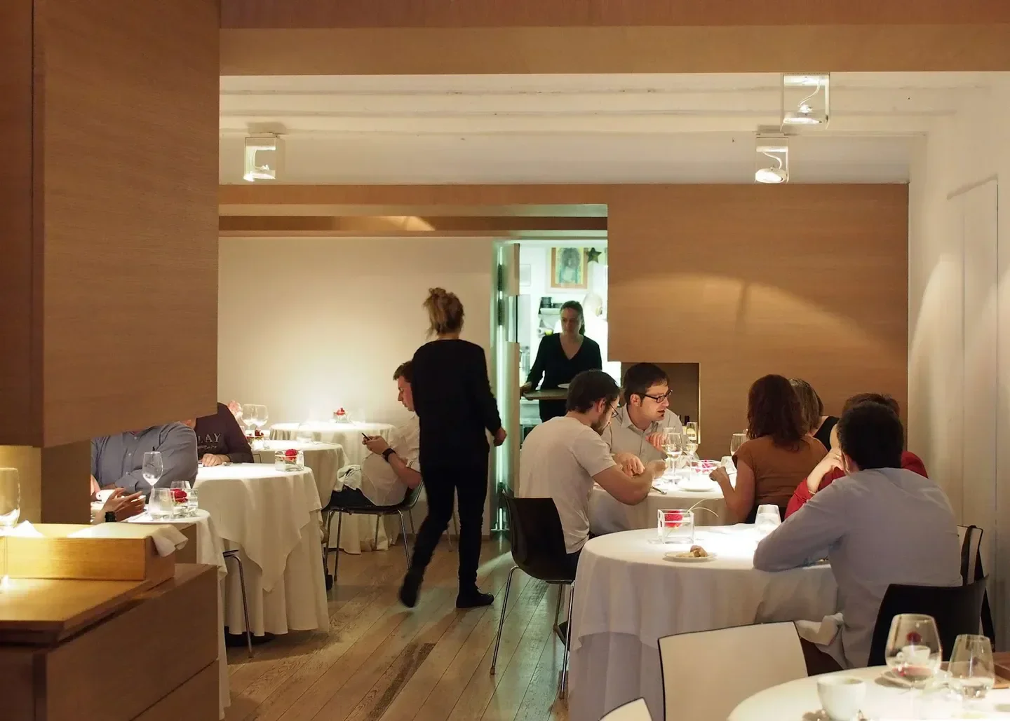 Interior of Hisop restaurant in Barcelona, with diners enjoying the elegant ambiance.