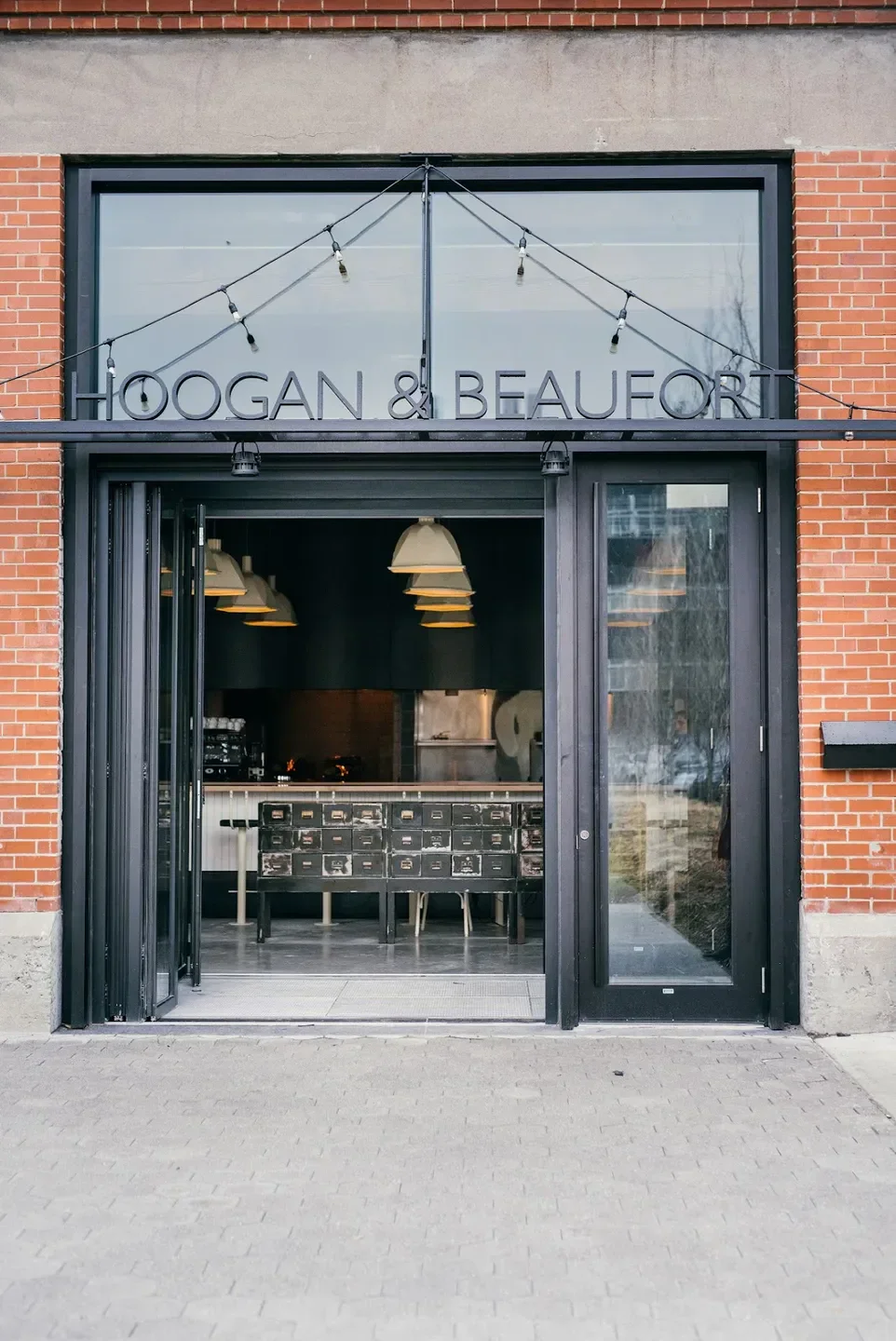 Entrance of Hoogan et Beaufort restaurant in Montreal, with industrial design