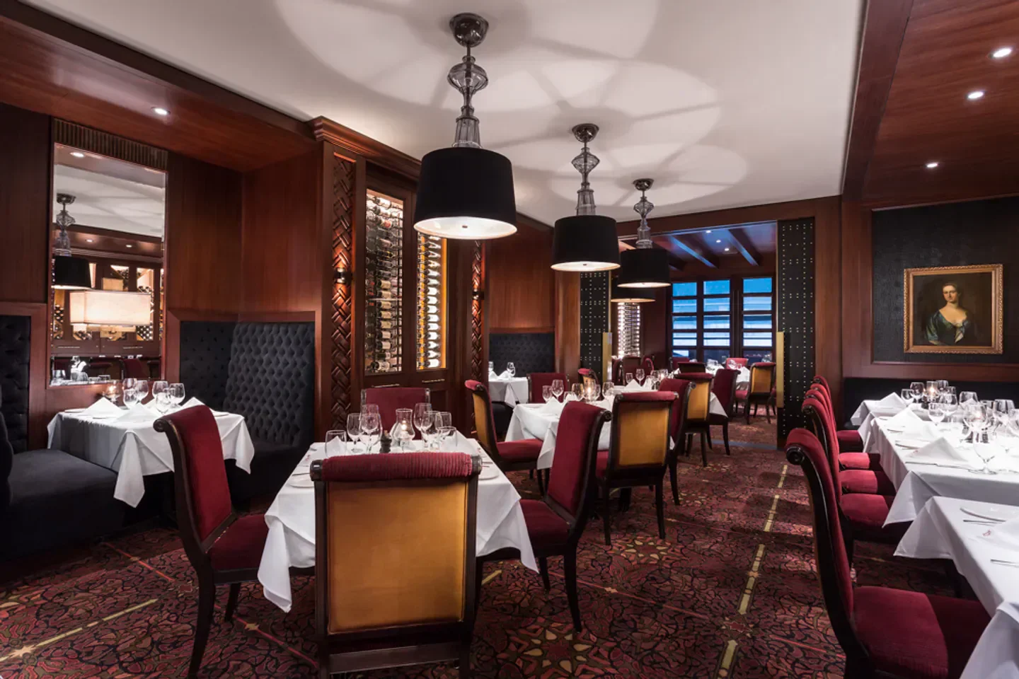Elegant dining room interior at Hy's Steakhouse in Vancouver, with classic decor.