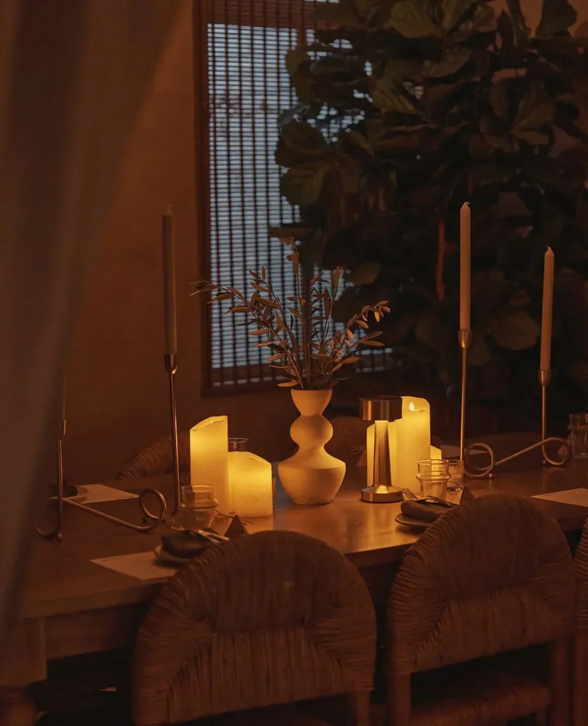 Cozy dining setting at Iberica in Sydney, with lit candles and a warm atmosphere.
