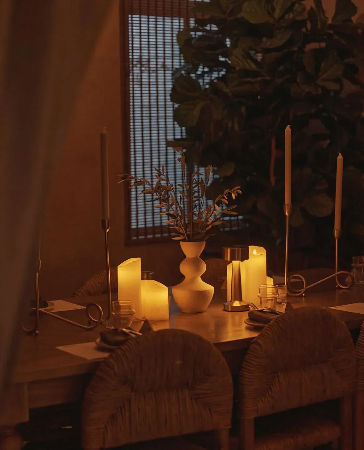 Cozy dining setting at Iberica in Sydney, with lit candles and a warm atmosphere.