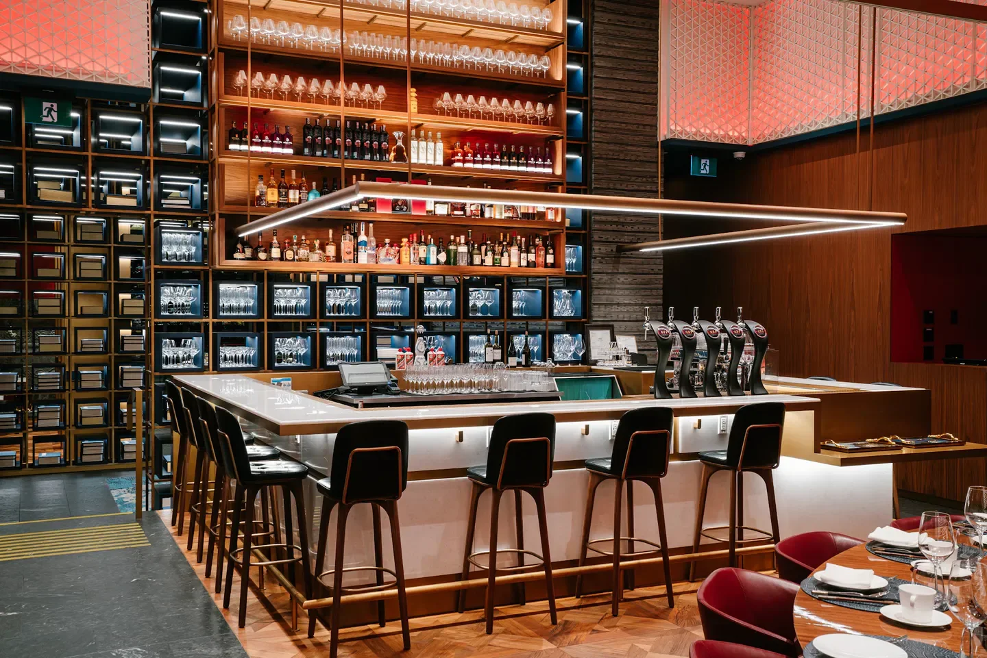 Stylish bar interior at iDen & QuanJuDe Beijing Duck House in Vancouver restaurant