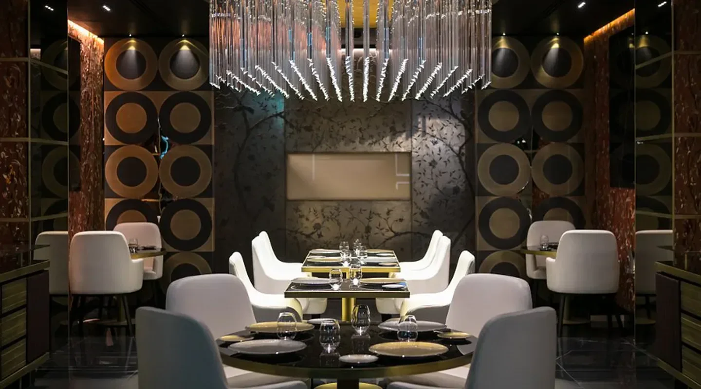 Elegant dining area at Idylio by Apreda in Rome, featuring stylish decor and seating.