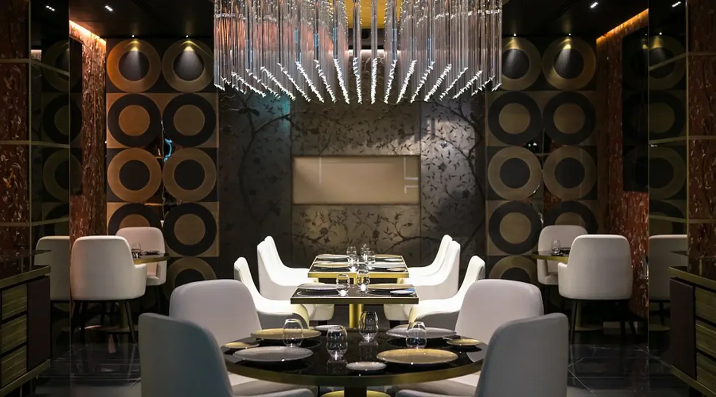 Elegant dining area at Idylio by Apreda in Rome, featuring stylish decor and seating.