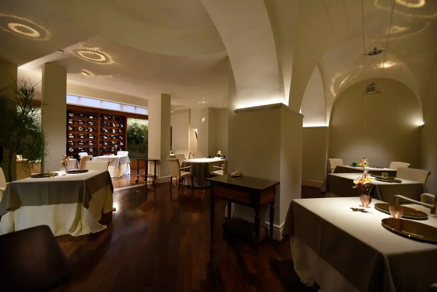 Elegant interior of Il Convivio Troiani restaurant in Rome, featuring a cozy dining space.
