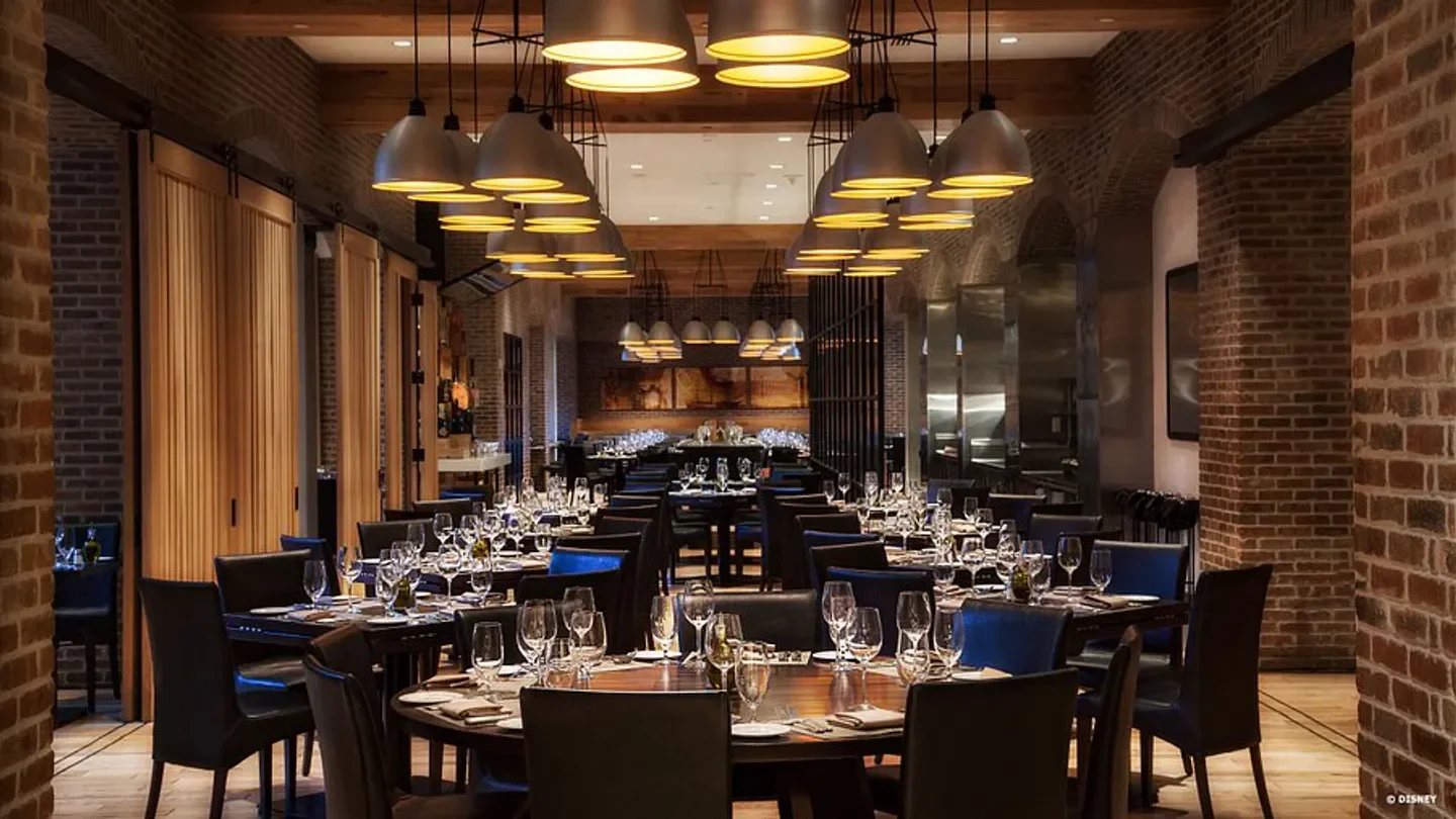 Elegant interior of Il Mulino New York Trattoria in Orlando, with a dining room set up.
