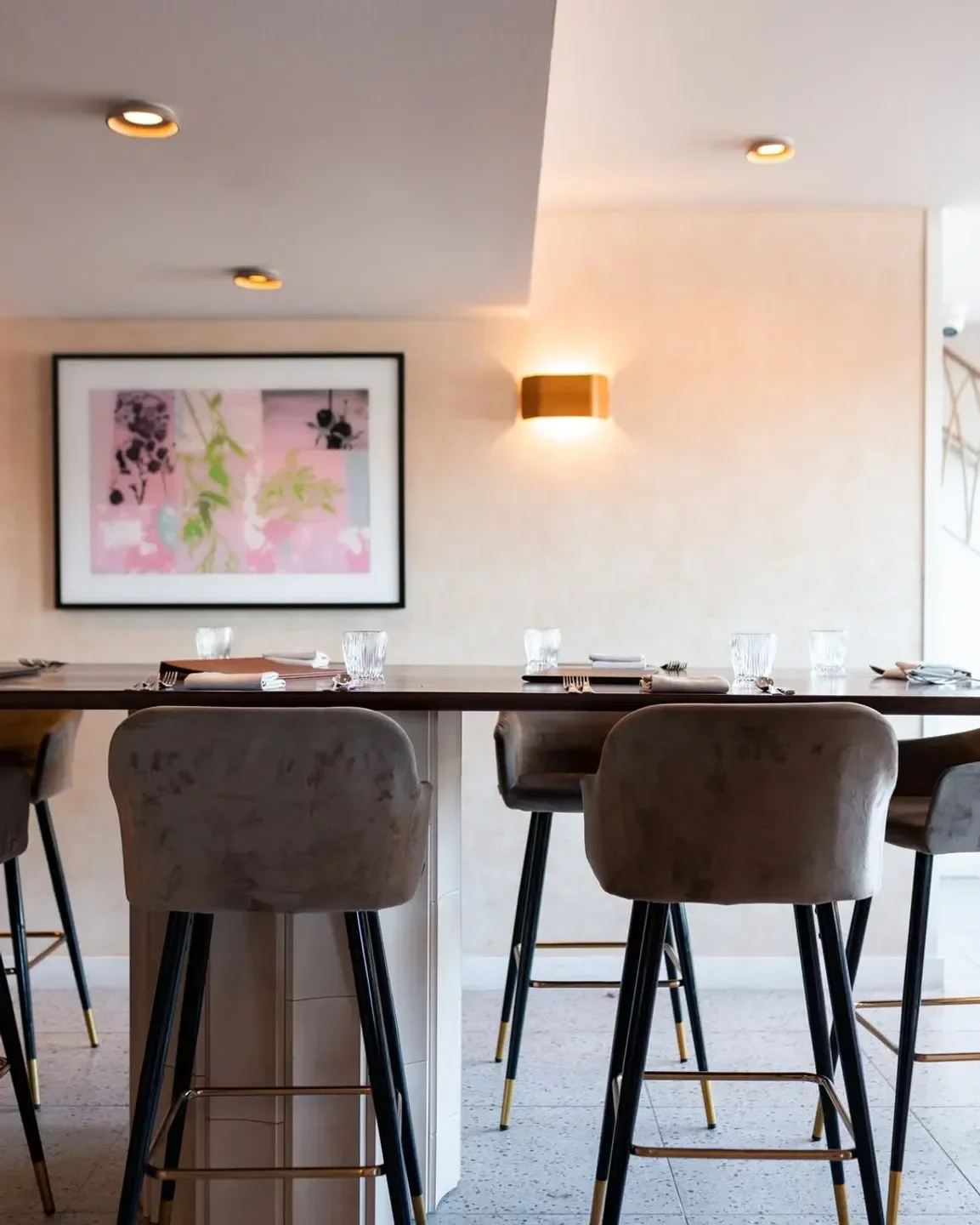 Interior view of Il Pontile restaurant in Sydney with stylish bar stools and decor.