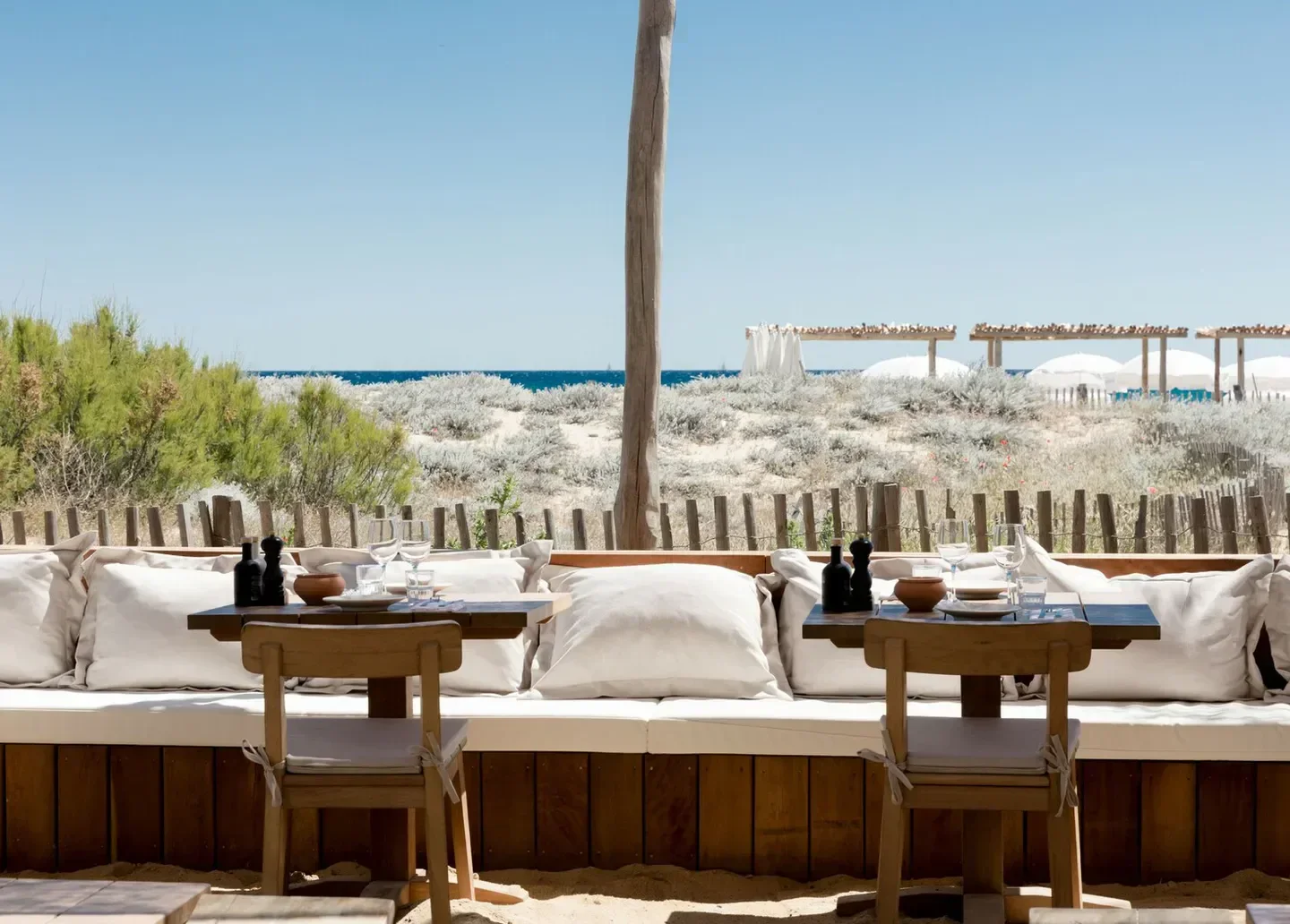 Indie Beach in Saint-Tropez: beach club seating with ocean view and sandy ground