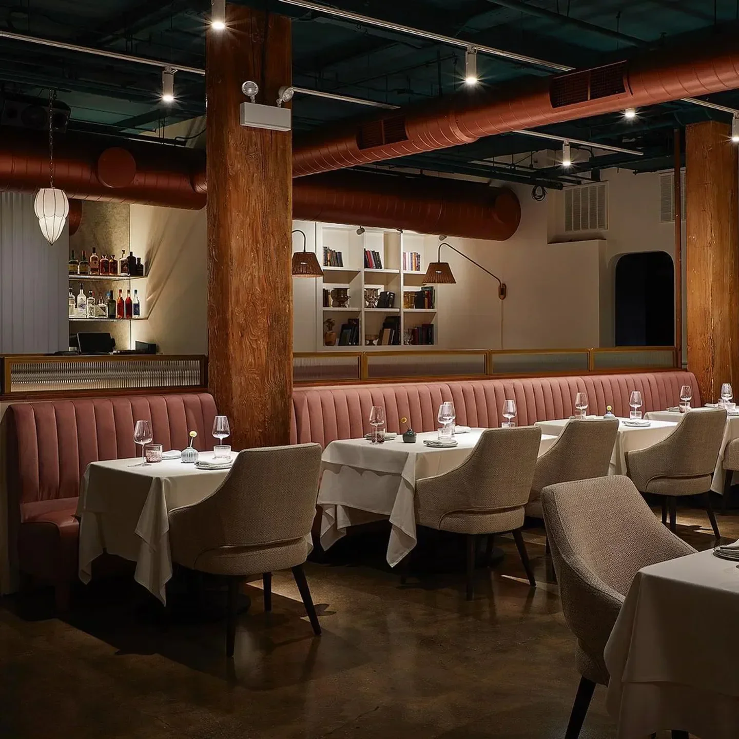 Interior of Indienne restaurant in Chicago, with elegant tables and decor.