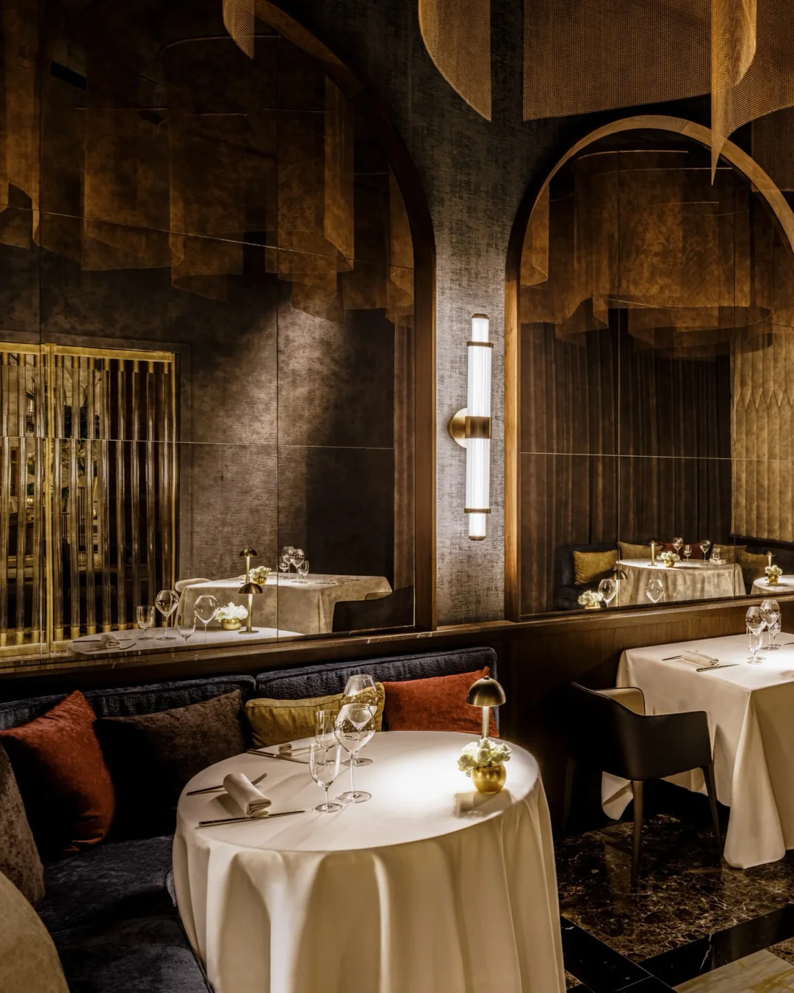 INEO restaurant in the city featuring elegant dining tables, plush seating, and modern ambient lighting with luxurious decor.
