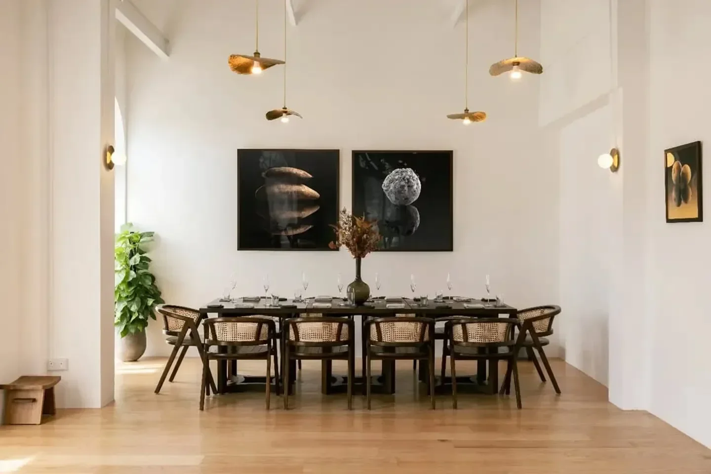 Elegant dining room interior at Jag restaurant in Singapore, featuring art and stylish chairs.