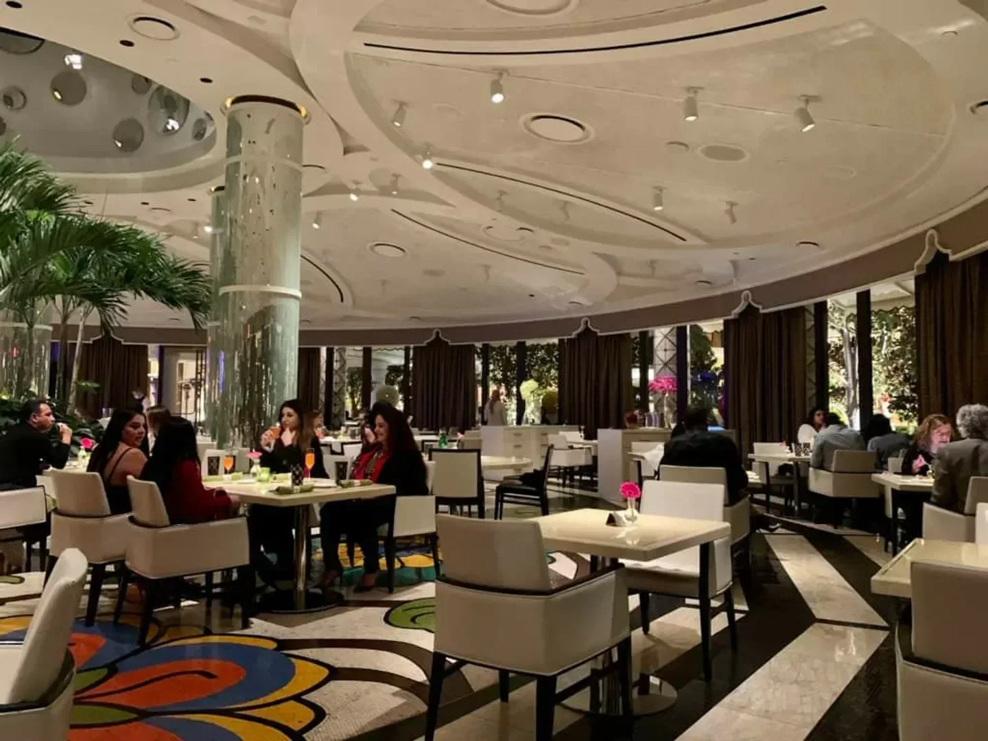 Elegant interior of Jardin in Las Vegas, featuring tables, diners, and a decorative ceiling.