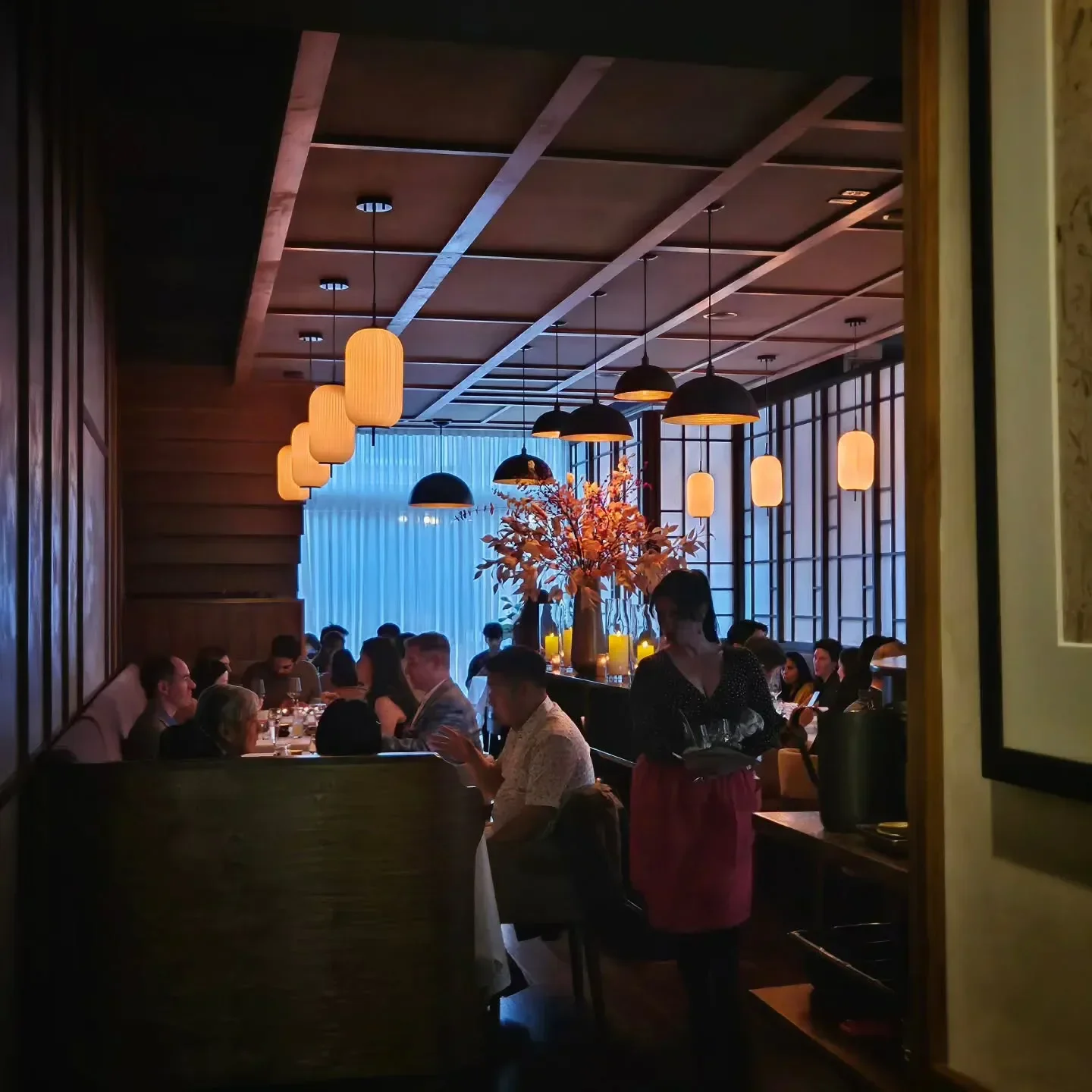 Cozy interior of Jeong restaurant in Chicago, with elegant lighting and dining ambiance