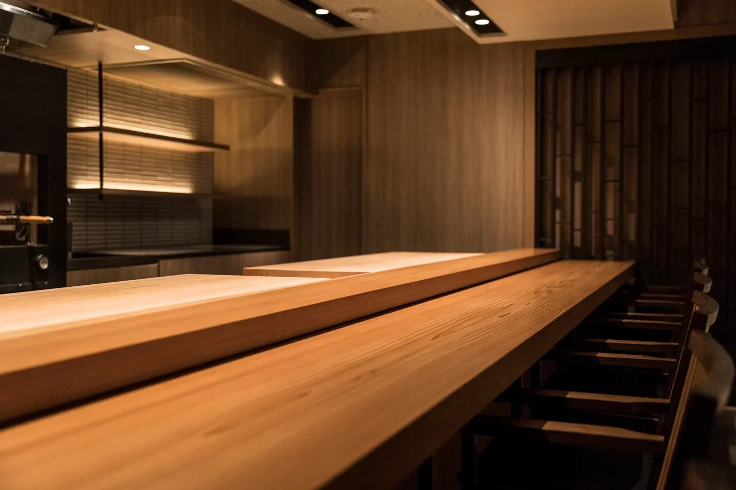 Minimalist interior of JO restaurant in Tokyo, featuring wooden tables and elegant design.
