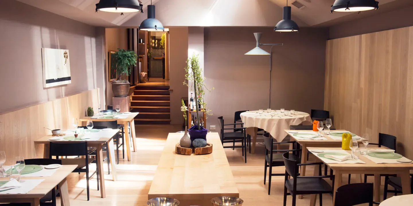 Interior of Joia restaurant in Milan with elegant table settings and decor.