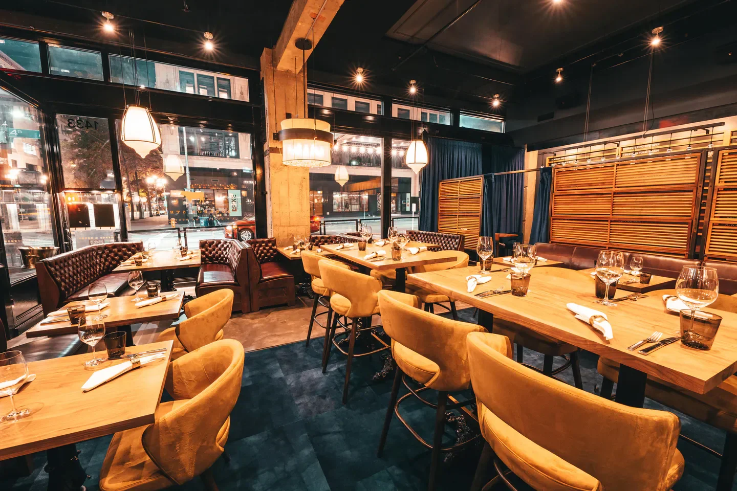 Interior dining space at Joule restaurant in Seattle, featuring warm lighting and modern decor.