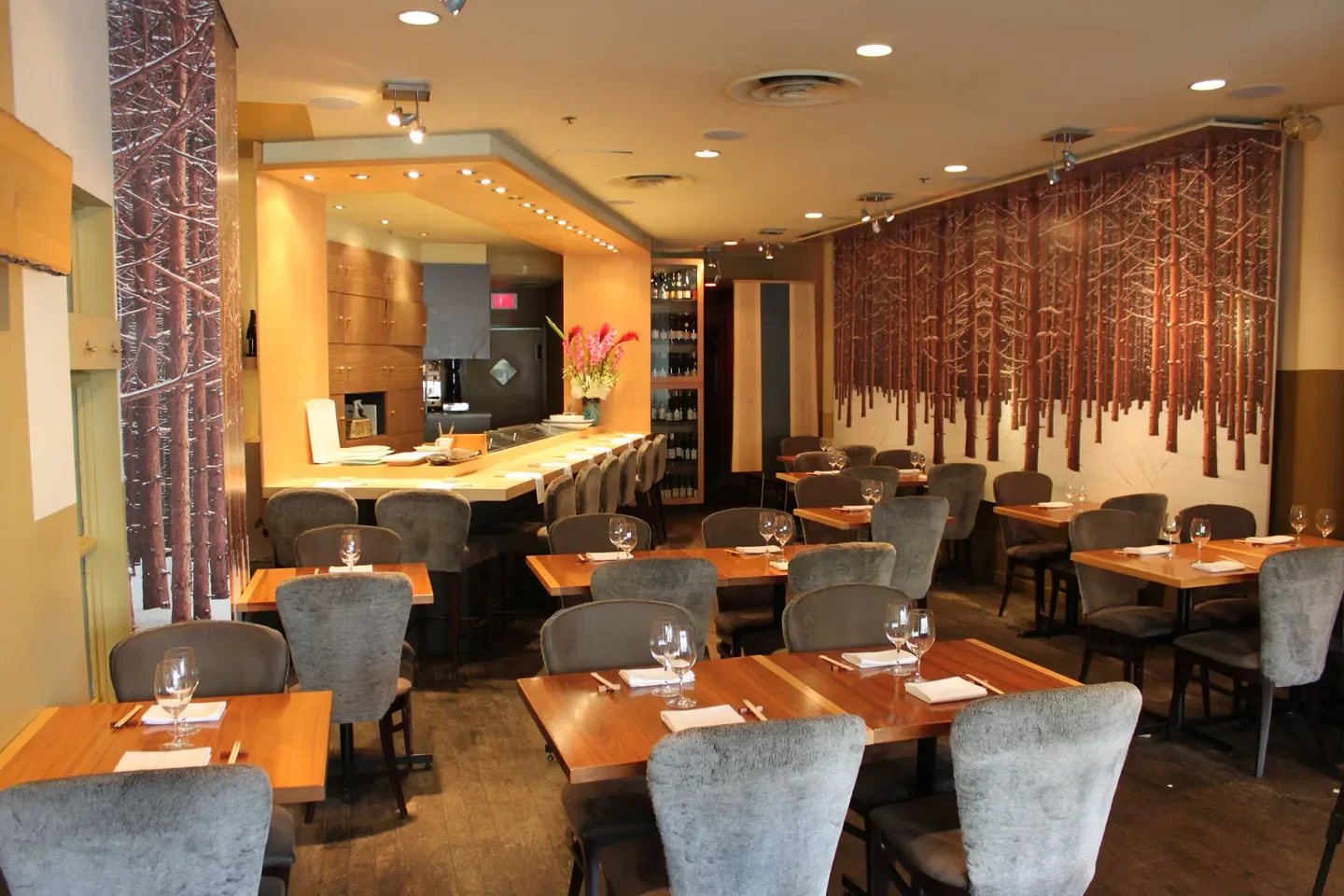 Interior view of Jun I restaurant in Montreal, featuring cozy seating and art.