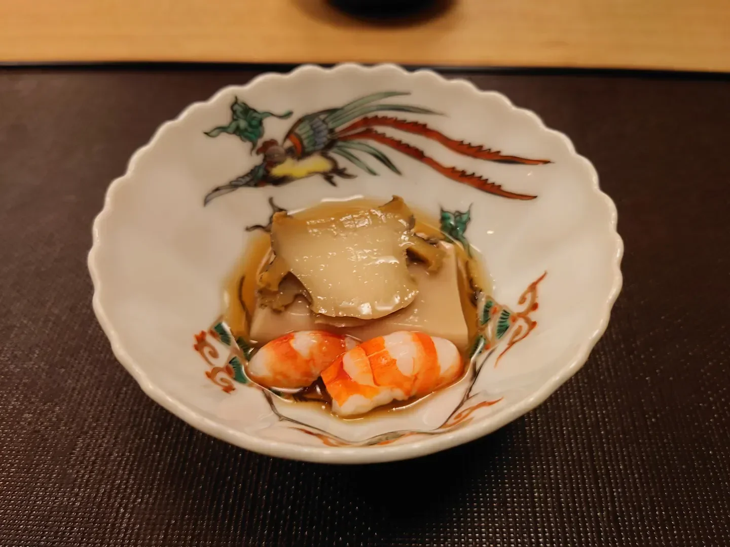 Kaiseki Ohara in Tokyo: exquisite seafood dish presented in a decorative ceramic bowl