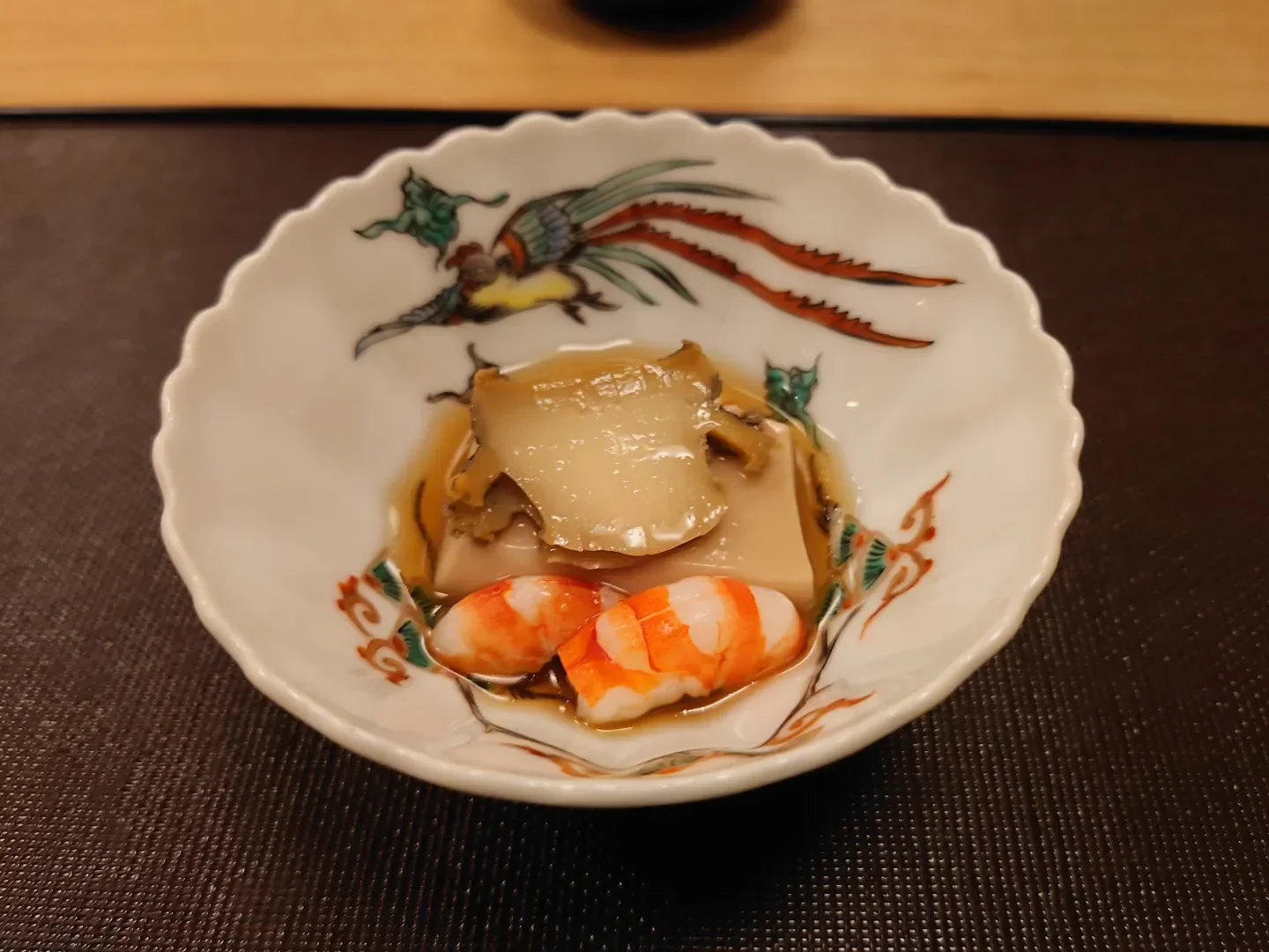 Kaiseki Ohara in Tokyo: exquisite seafood dish presented in a decorative ceramic bowl