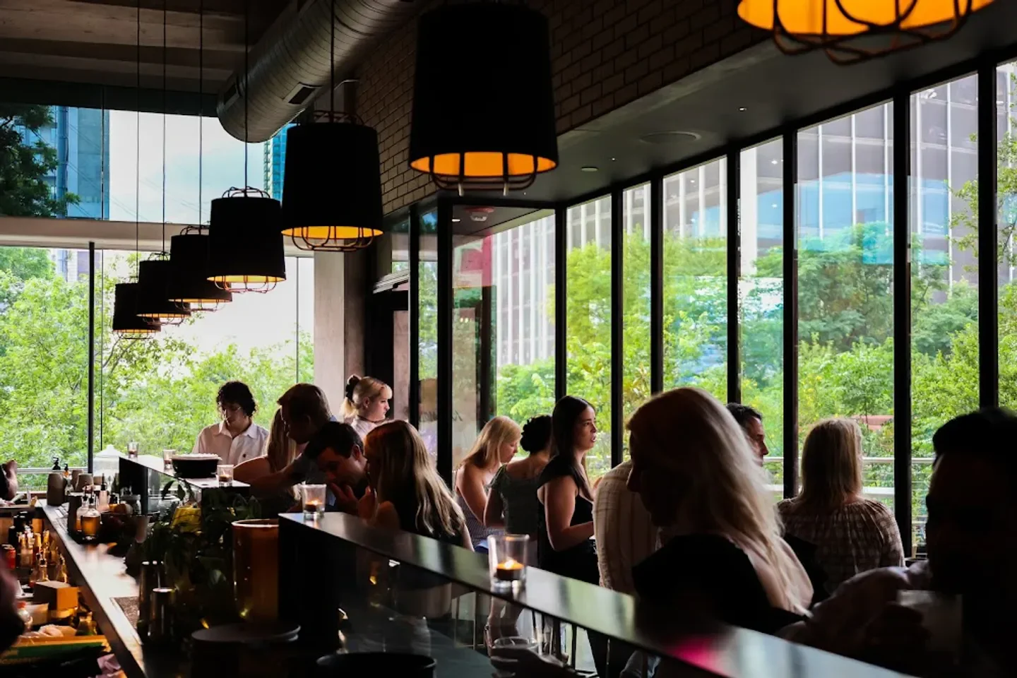Interior of Kalimotxo restaurant in Austin with people at the bar