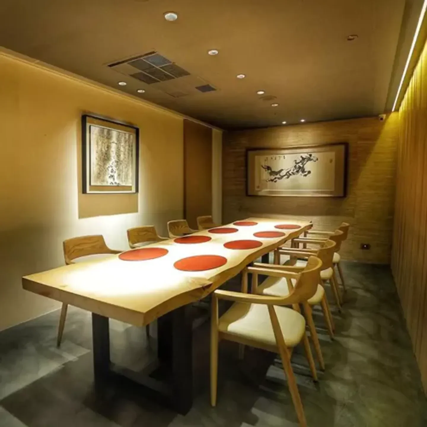 Elegant dining room at Ken Anhe restaurant in Taipei with a wooden table and chairs.