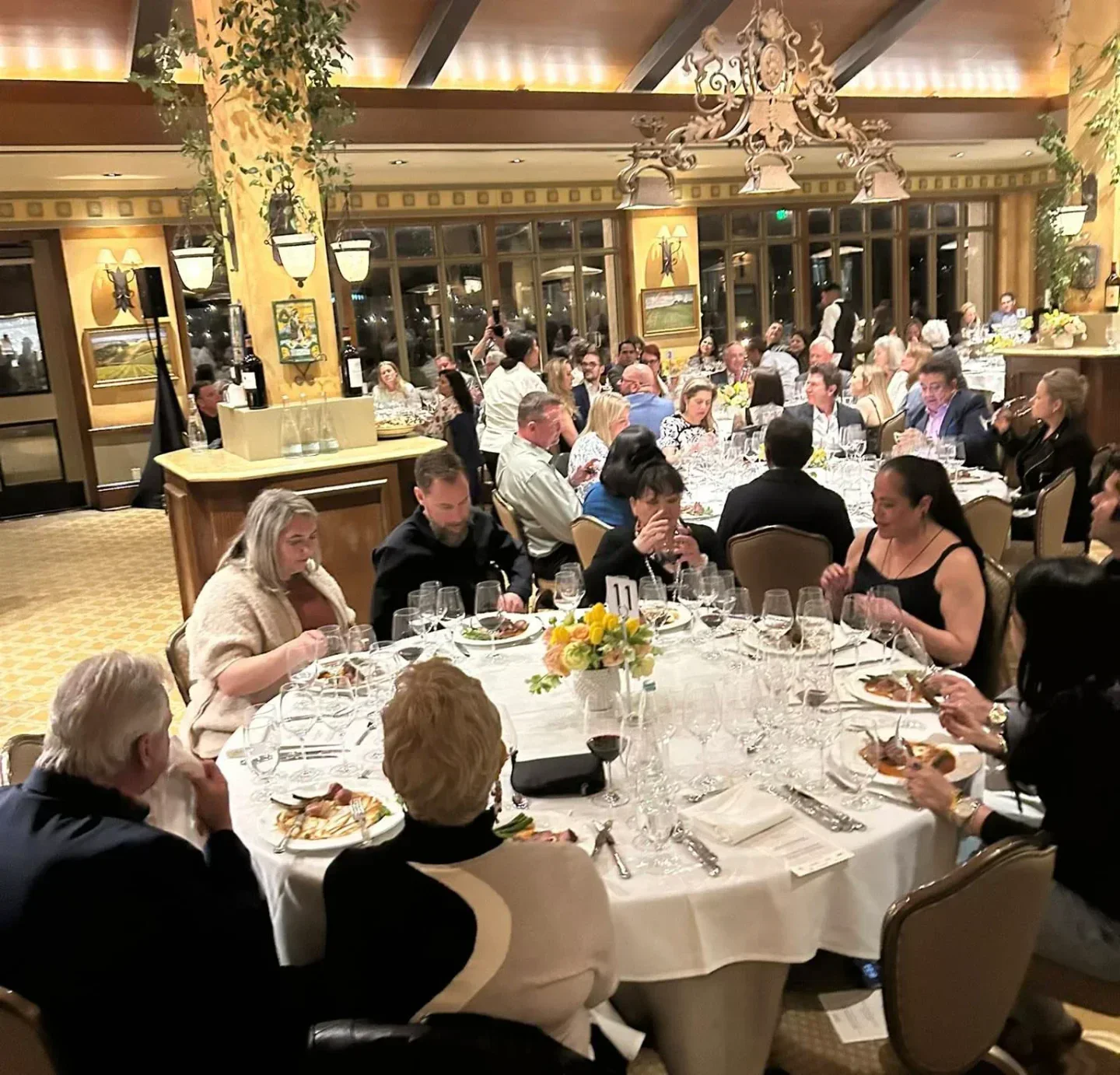 Dining scene at Kiran's in Houston, elegant setting with guests enjoying a meal.