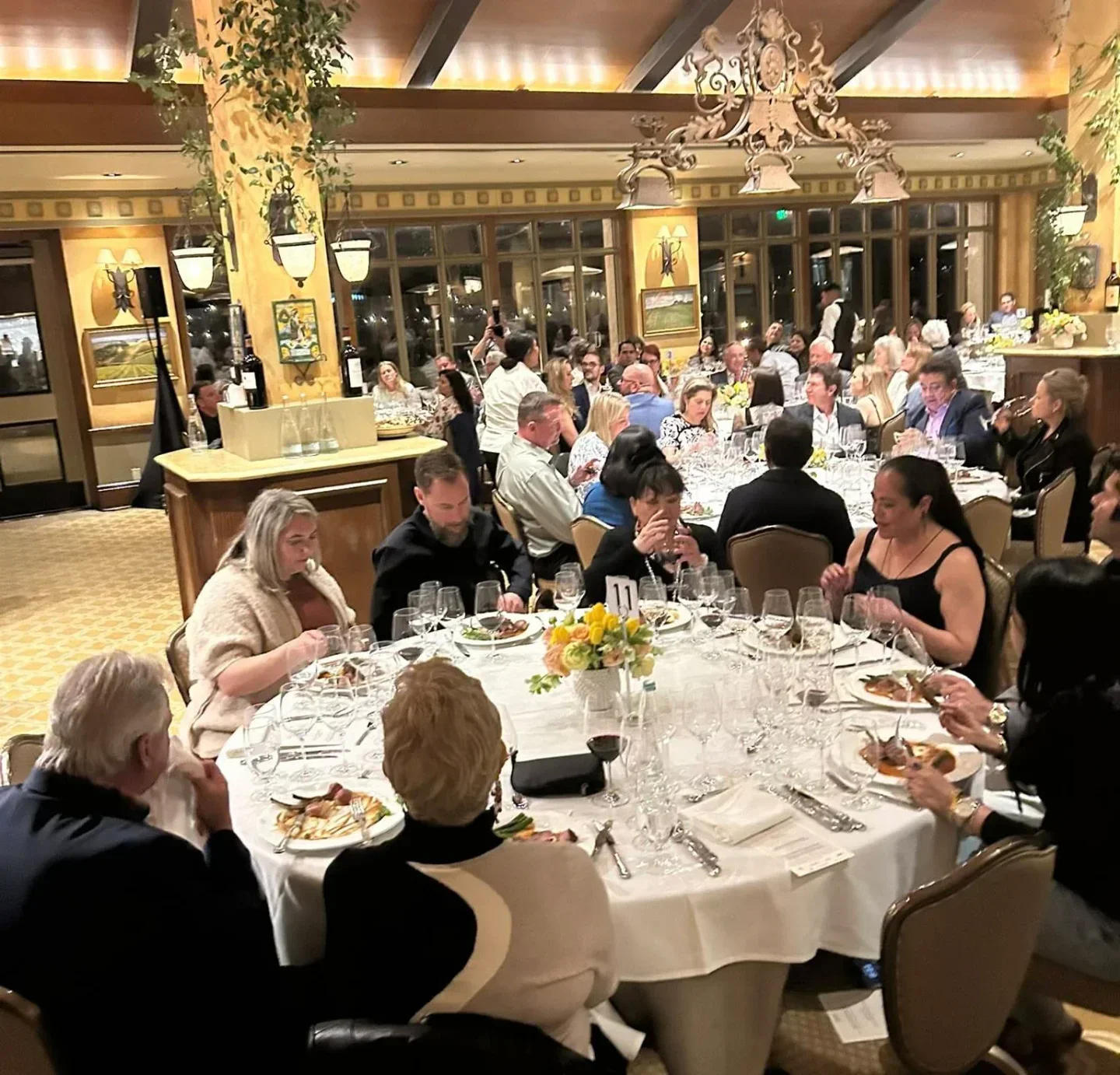 Dining scene at Kiran's in Houston, elegant setting with guests enjoying a meal.