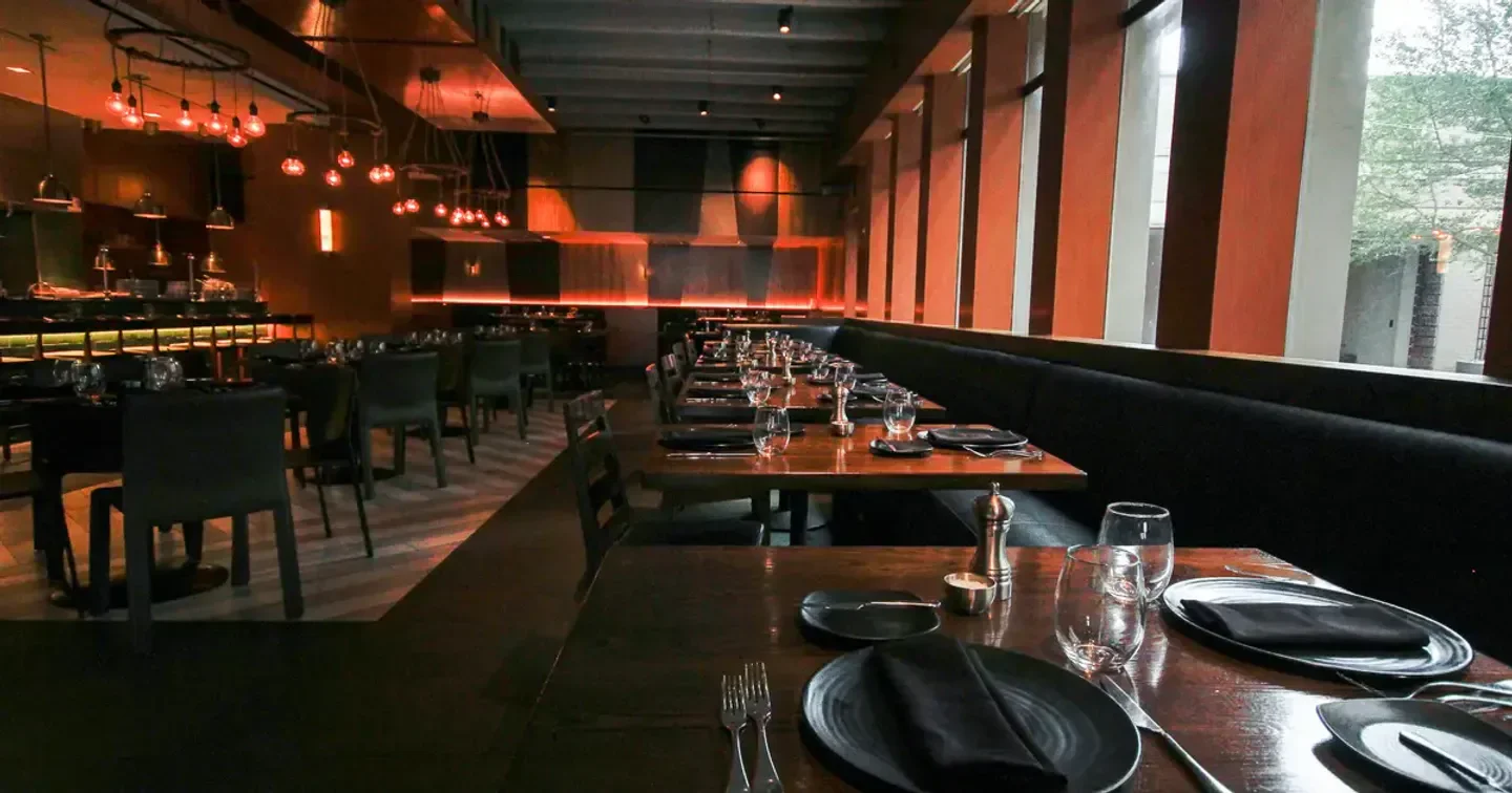 Interior of Knife - Dallas restaurant with tables set for dinner, Dallas.