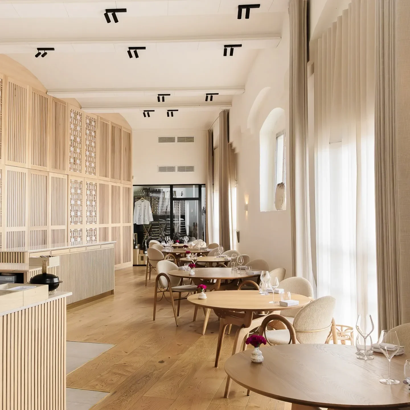 Interior of Koan restaurant in Copenhagen, featuring wooden tables and elegant design.