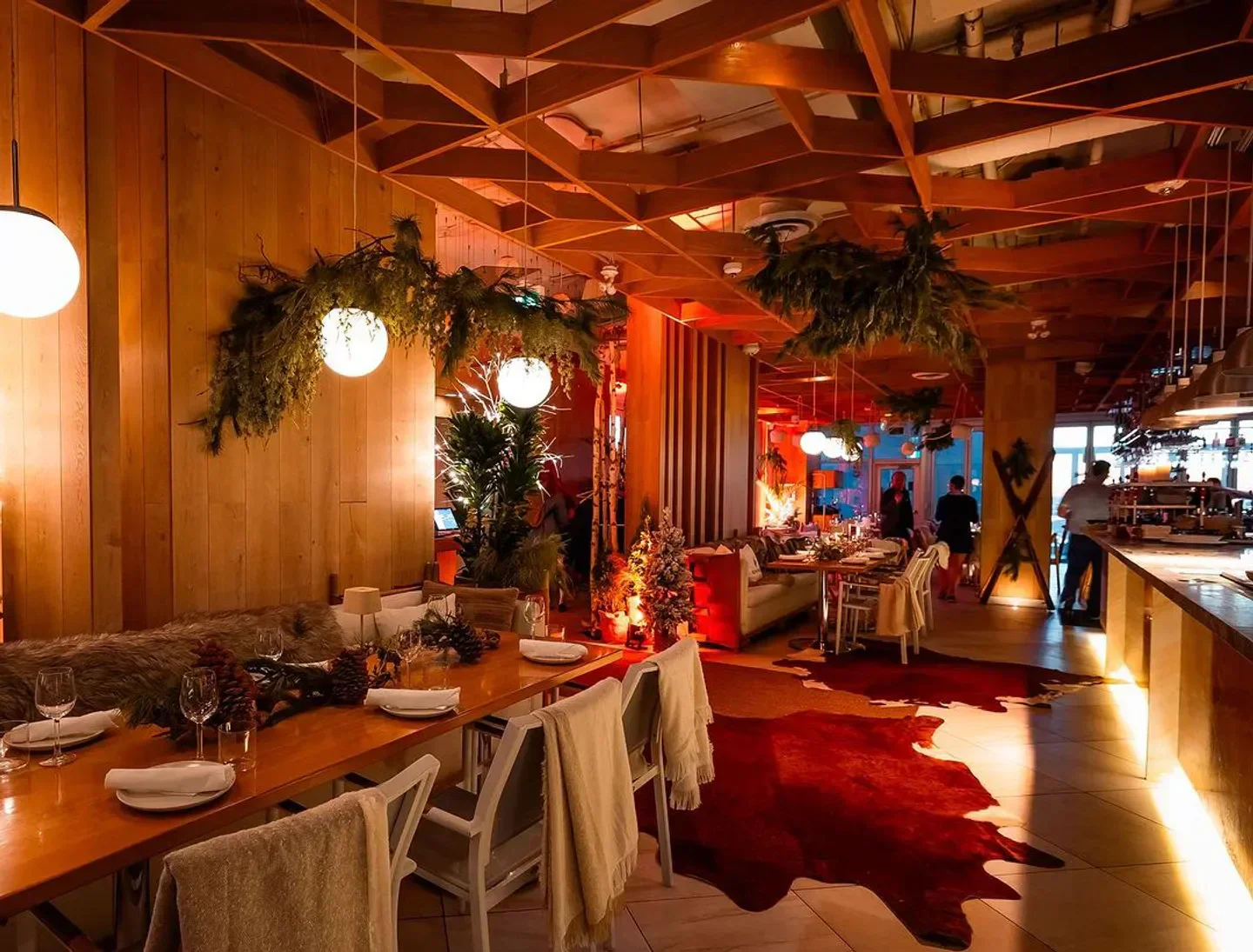 Cozy interior of Kost restaurant in Toronto, featuring warm lighting and elegant dining.