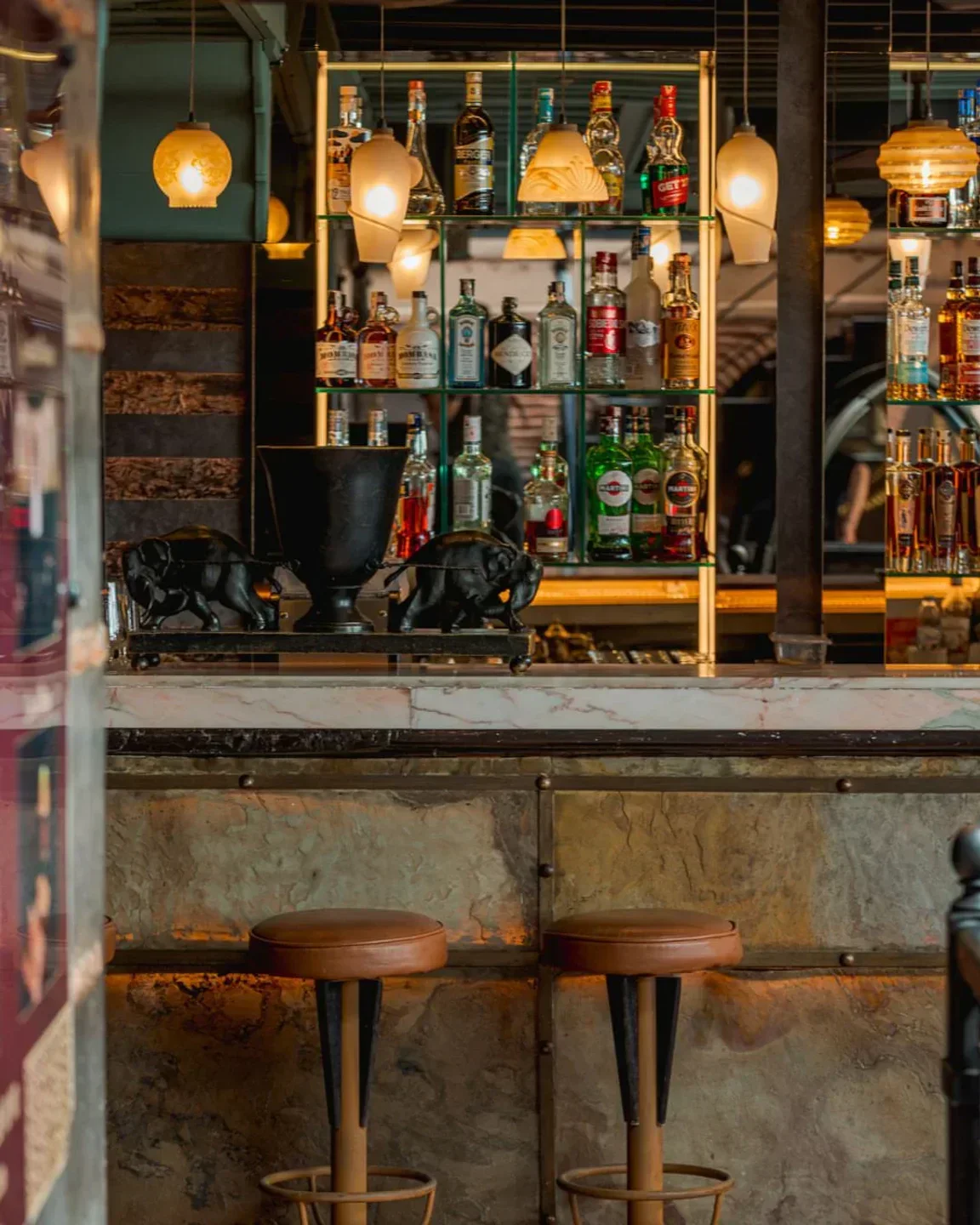 Interior bar at Kosybar in Marrakech, with bottles and stools