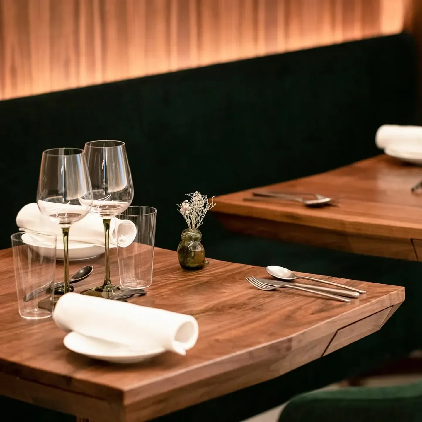 Dining table setting at La Condesa restaurant in Paris, with elegant glassware and decor.