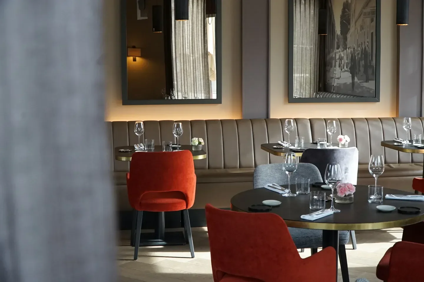 Interior of La Micheline restaurant in Geneva, with elegant table settings and decor.