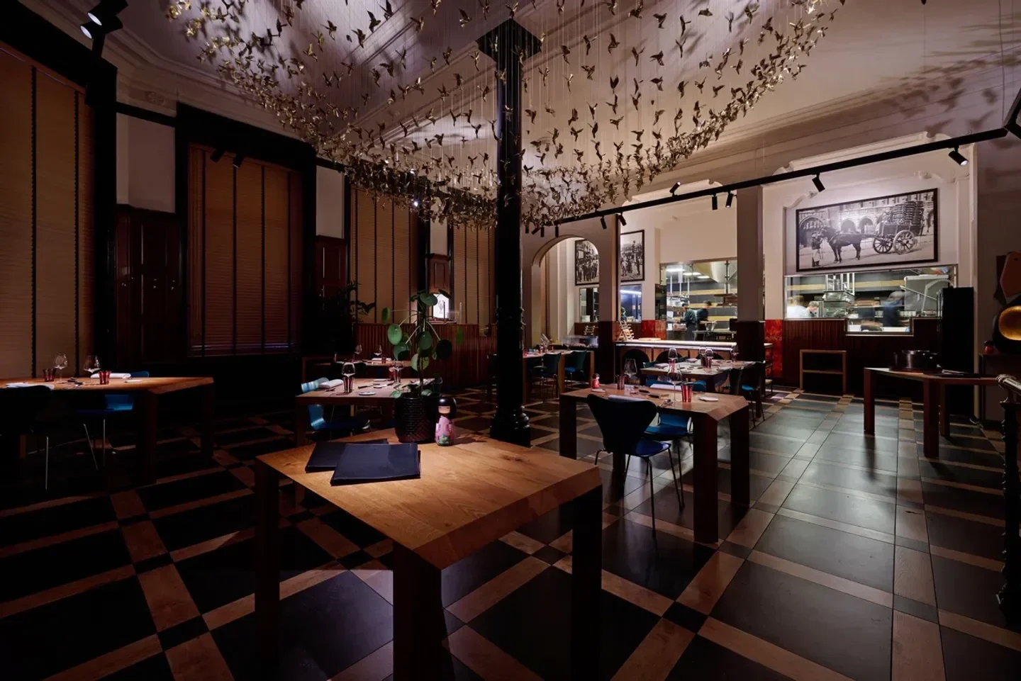 Interior of La Paix restaurant in Brussels, featuring artistic decor and elegant dining setting.